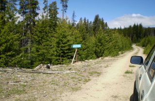 Sign 2.8 KM from barrier pointing to a trail to Sheep rock on road to Brent Mtn trail 2010-07.